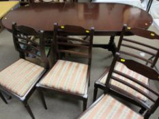 Modern dark wood extending dining table and four matching ladderback chairs