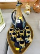 Continental pottery decanter, cups and tray set