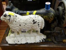 Cast metal ram door stop and a vintage Singer sewing machine