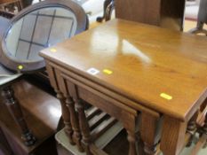 Oak nest of three tables and a wooden framed oval wall mirror