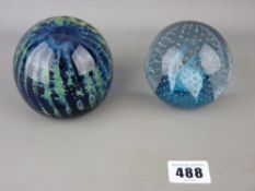 Caithness paperweight titled 'Cauldron Aqua' and a Mdina glass paperweight