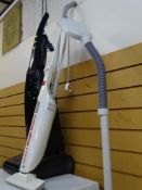 Upright Electrolux vacuum cleaner, Bissell Magicbroom and modern standard lamp E/T