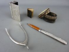 Pair of silver wishbone tongs, a chased silver pencil, an EPNS snuff box and a horn example