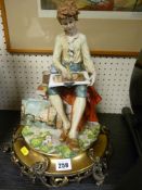 Quality Capodimonte figurine depicting a young boy painting with artist's materials on a metallic
