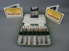 Cased set of six silver teaspoons, two 1983 Maxwell House presentation one pound coins and a perspex