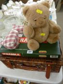 Wicker picnic basket, a Scrabble board game and two soft toys