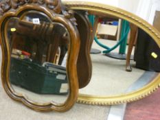 Two elaborately decorated wall mirrors