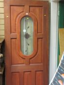 Hard wood door with central opaque glazed window, 240 x 81 cms