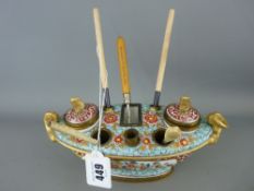 French porcelain and gilt metal boat shaped inkstand with pseudo Oriental style decoration (damage)