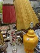 Modern Galileo thermometer and three decorative table lamps