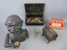 Cast iron Dinah moneybank and one other, a quantity of vintage coinage and two tins etc