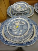 Five blue and white meat platters and seventeen various similarly patterned plates