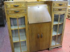 Light oak display cabinet with central bureau over twin base cupboards