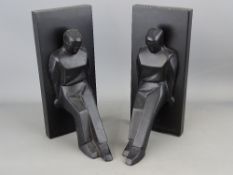 Pair of Art Deco style black bookends marked 'Chris Collicott for Kikkerland'