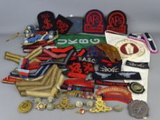 Mixed quantity of embroidered metal badges and buttons etc, mainly military related