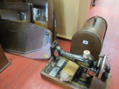 Cased Singer sewing machine and a quantity of wall hanging mirrors etc