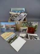 Collection of vintage postcards and photographs