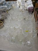 Good selection of cut and other drinking glassware, two vintage decanters with stoppers etc