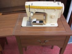 Singer sewing machine contained in a work table