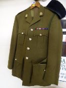 Circa 1940's Moss Bros Army dress uniform having buttons and lapel badges with Royal Army Dental