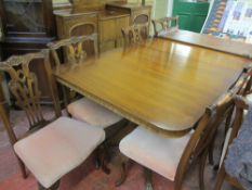 Mahogany extending dining table with eight (six plus two) Chippendale style chairs by Bevan