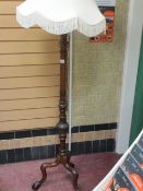 Mahogany turned and carved standard lamp on tripod ball and claw feet with shade E/T