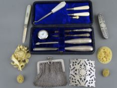 925 marked chainmail purse, a belt buckle and a mother of pearl silver bladed fruit knife along with