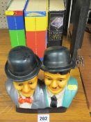 Novelty Laurel & Hardy figures and a collection of Harry Potter books