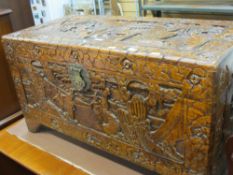 Oriental heavily carved camphor wood trunk