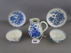Circa 1770 Worcester blue and white sparrow beak jug and two tea bowls with saucers, all fence