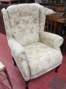 Floral upholstered wingback armchair
