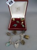Silver charm bracelet with padlock clasp, mounted with six composite scarab beetles having