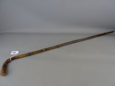 Vintage bamboo walking cane with knotty handle and silver collar