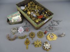 Vintage tin of British and German military cap badges and buttons etc, a small quantity of London