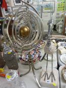 Contemporary metal armillary sphere type ornament and a wood and metal bird ornament