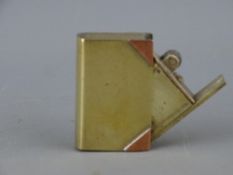 Small vintage pocket petrol lighter in the form of a book