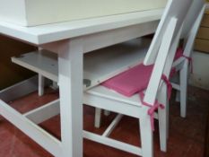 White modern IKEA style extending dining table and four chairs