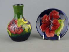 Moorcroft 'Hibiscus' 12 cms high vase, green ground and an 11.5 cms diameter pin dish in 'Hibiscus'