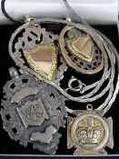 Four silver and yellow metal pendant fobs