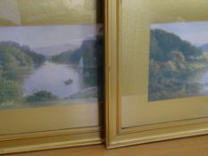 J W GOZZARD pair of neatly framed prints - lake scenes with rowing boats, 22 x 32 cms