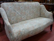 Small Georgian parlour settee with floral upholstery on castors