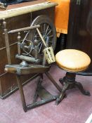 Vintage spinning wheel and upholstered tripod stool