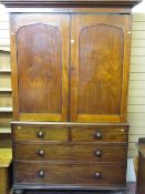 Late 19th Century two piece mahogany press cupboard, the upper section having full length sliding