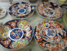 Four 30 cms diameter Imari chargers along with two smaller examples