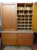 Vintage pine cupboard with pigeonhole interior over a fall front base openings