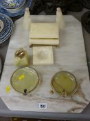 Marble chopping board, two metal mounted onyx ashtrays, a pair of alabaster bird bookends and two