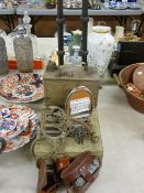 Pair of three foot iron pricket candle stands, a vintage petroleum can, a chrome plated stirrup