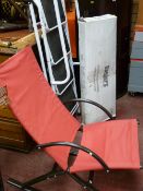 White metal four tread stepladder with side rails, metal canvas upholstered rocking chair and