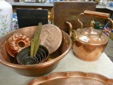 Victorian copper kettle with acorn knop, a large two handled pan, a set of six brass handled