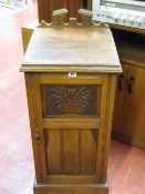 Oak bedside pot cabinet with carved detail